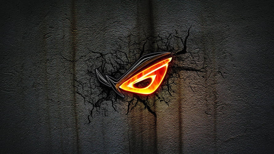 Glowing ROG Eye Logo Breaking Through Cracked Dark Concrete Wall HD wallpaper