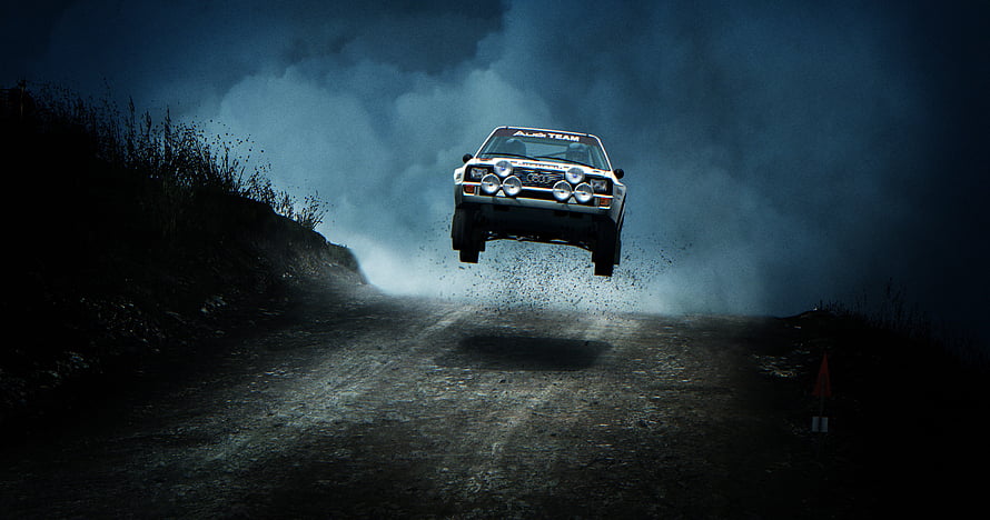 Audi Quattro Group B Rally Car Launching Over a Gravel Crest at Night HD wallpaper