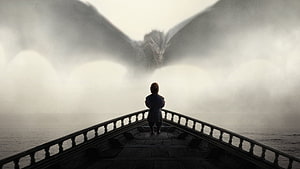 Game of Thrones: Lone Figure on Misty Bridge Facing Dragon Silhouette HD wallpaper