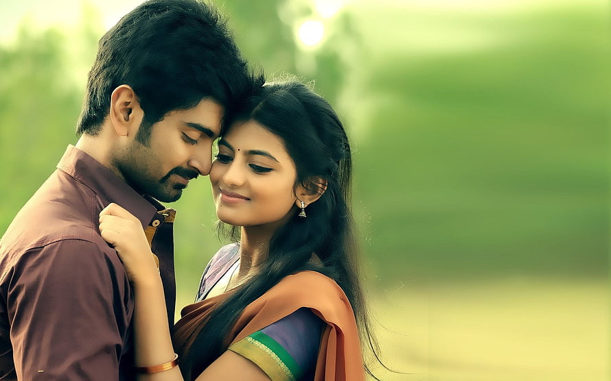 Romantic Tamil Couple Embracing in Lush Green Garden Setting HD wallpaper