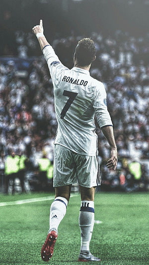 Cristiano Ronaldo in Real Madrid White Kit Pointing to the Sky During a Match HD phone wallpaper