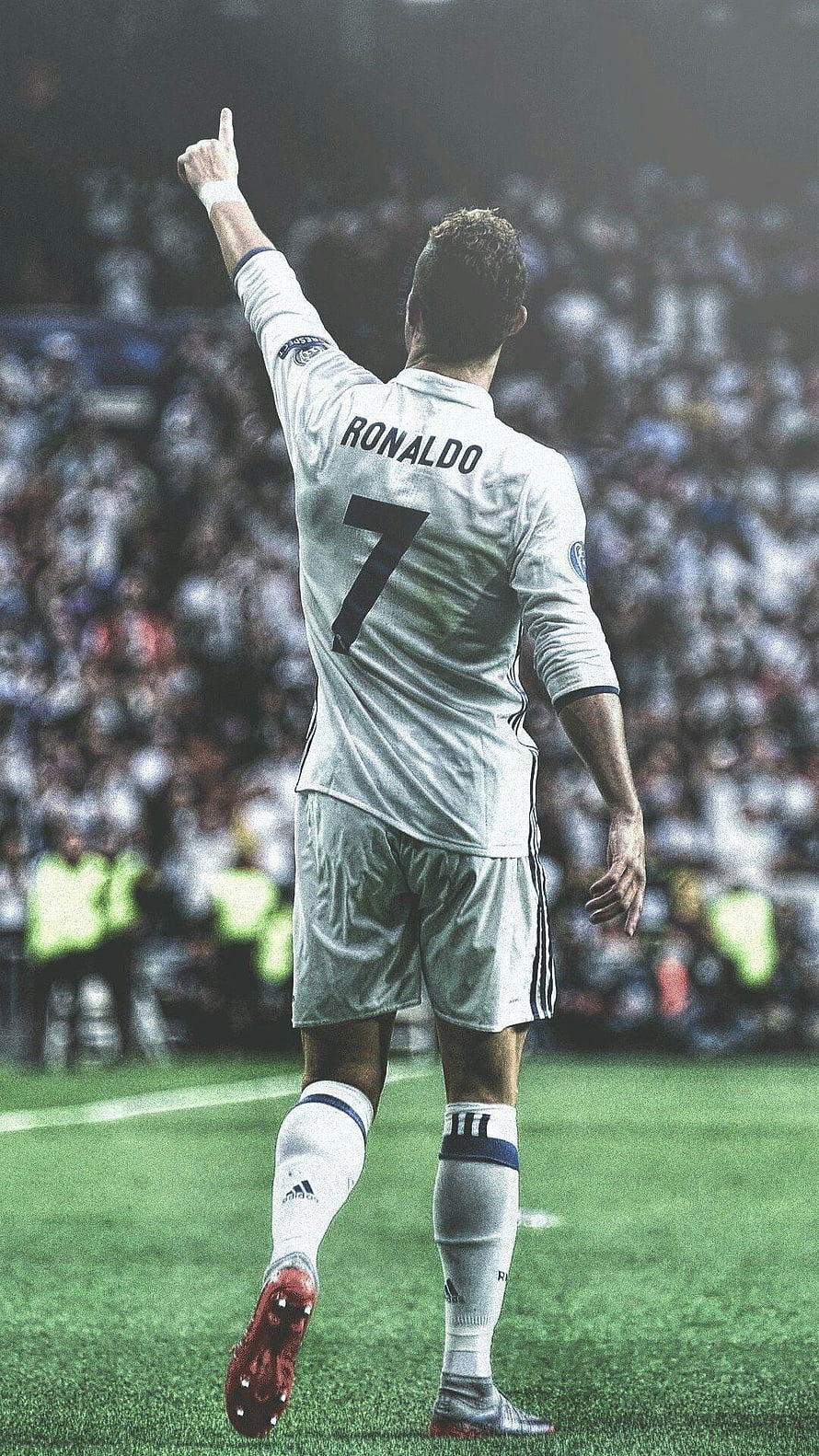 Cristiano Ronaldo in Real Madrid White Kit Pointing to the Sky During a Match HD phone wallpaper