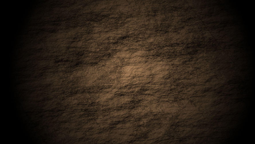 Dark Textured Grunge Background with Warm Center Glow and Vignette HD wallpaper