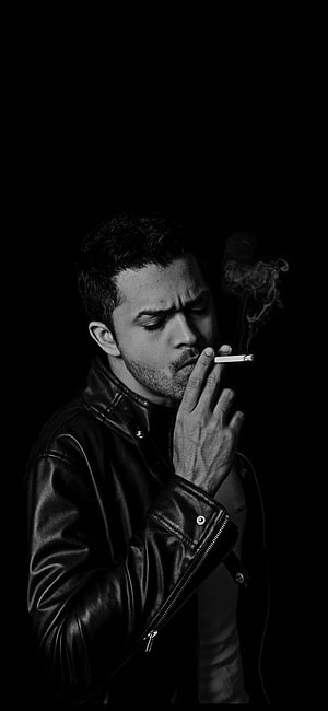 Black and White Portrait of a Man in a Leather Jacket Smoking a Cigarette HD phone wallpaper