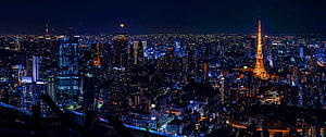 Tokyo Skyline at Night with Tokyo Tower and Full Moon Over the City HD wallpaper