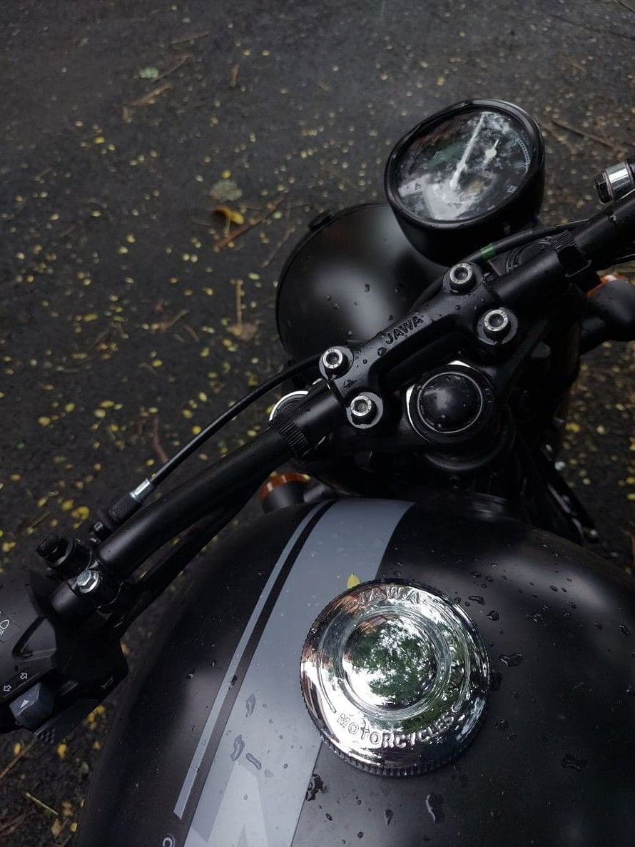Jawa 42 Motorcycle Handlebar and Fuel Tank Close-Up with Rain Droplets HD phone wallpaper