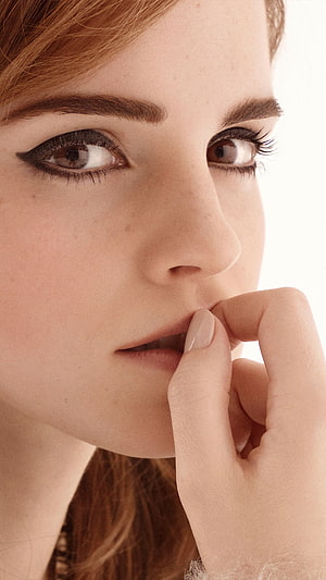 Emma Watson Close-Up Portrait with Dramatic Eye Makeup and Contemplative Expression HD phone wallpaper