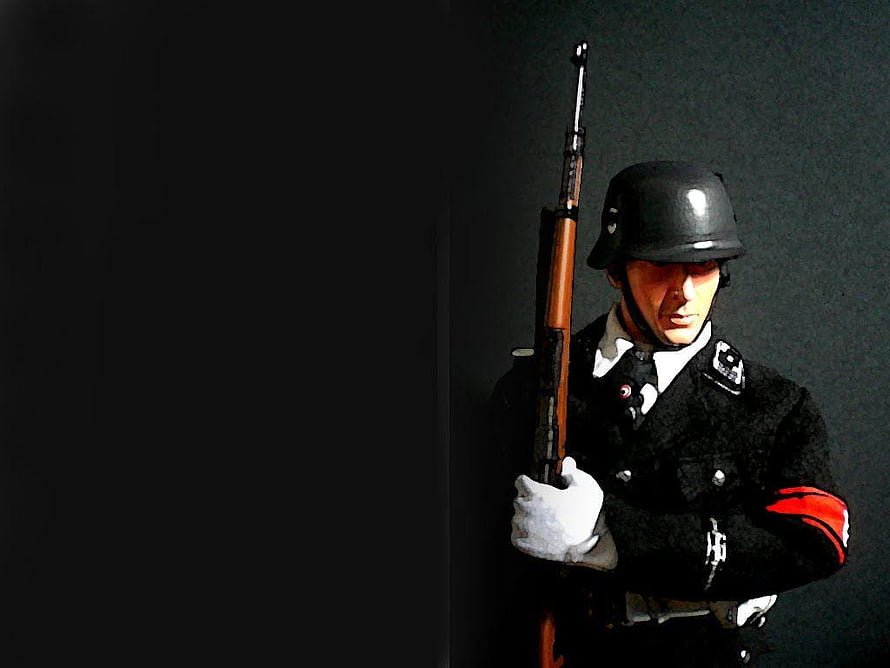 World War II German Soldier in Dark Uniform Holding Rifle Against Black Background HD wallpaper