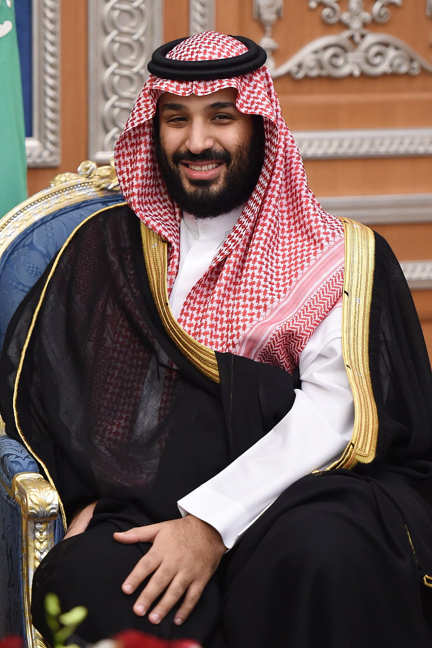 Mohammed bin Salman in Traditional Saudi Attire Seated on Ornate Throne HD phone wallpaper