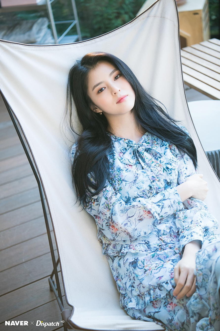 Han So Hee in a Floral Dress Reclining on a White Outdoor Lounge Chair HD phone wallpaper