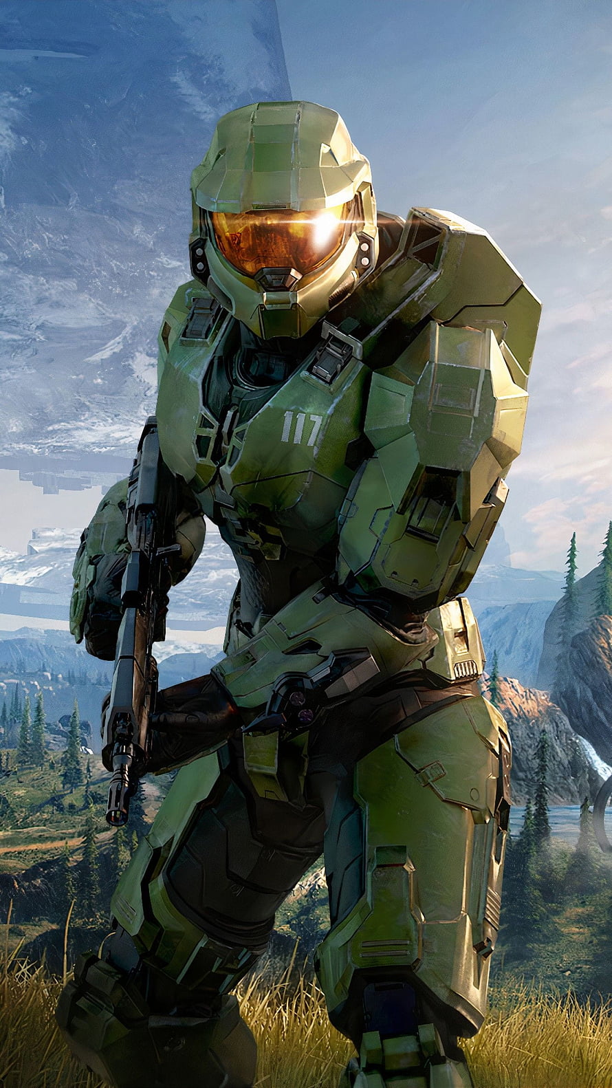 Master Chief in green armor holding a rifle in a mountainous landscape from Halo Infinite HD phone wallpaper