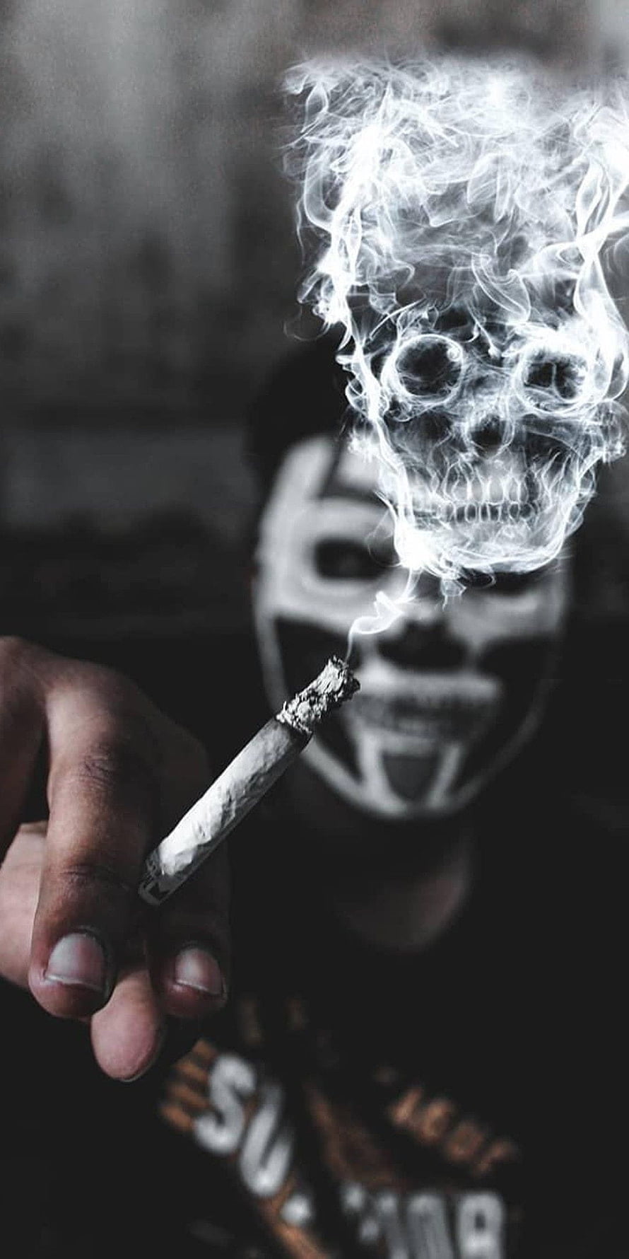 Man with skull face paint holding cigarette with smoke forming a skull shape HD phone wallpaper