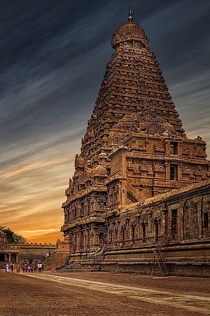 Brihadeeswarar Temple in Thanjavur India at sunset with dramatic sky and intricate stone carvings HD phone wallpaper
