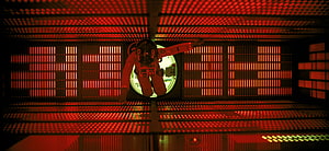 2001: A Space Odyssey astronaut floating in red-lit spacecraft corridor HD wallpaper