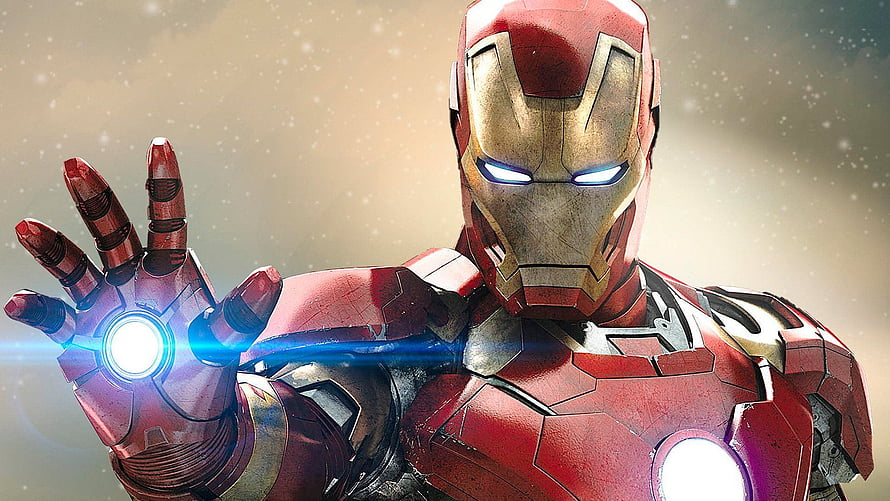 Iron Man in Red and Gold Armor with Glowing Repulsor Hand and Arc Reactor HD wallpaper