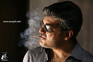 Ajith Kumar in Mankatha smoking a cigarette with aviator sunglasses HD wallpaper