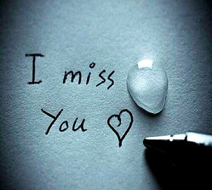 Handwritten I Miss You Note with Heart and Pen on Textured Paper HD wallpaper