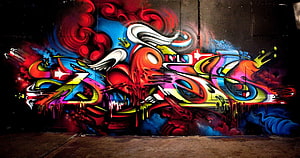Vibrant Colorful Graffiti Mural on Dark Urban Wall with Drips and Swirls HD wallpaper