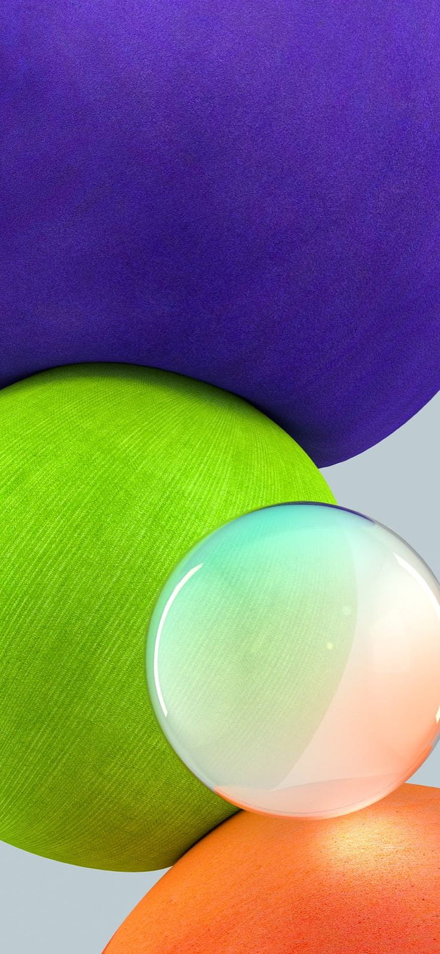 Colorful 3D spheres with a glass orb on a light blue background HD phone wallpaper
