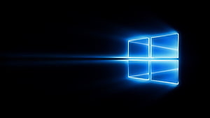 Glowing Windows 10 Logo on Dark Background with Reflection and Light Streak HD wallpaper