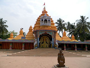 Maa Tarini Temple Golden Shikhara with Palm Trees and Stone Steps HD wallpaper