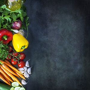 Fresh Vegetables and Herbs Arranged on Dark Slate Surface HD phone wallpaper