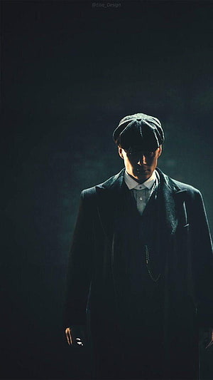 Peaky Blinders Tommy Shelby in Dark Suit and Flat Cap Dramatic Portrait HD phone wallpaper