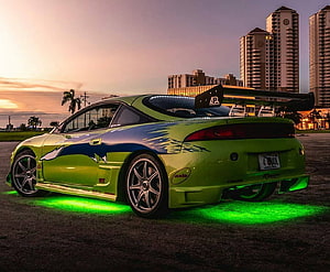 Lime Green Modified Sports Coupe with Underglow and Large Rear Wing at Sunset HD wallpaper