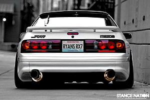 Rear View of a White Mazda RX-7 FC with Gold Exhaust Tips and Custom Taillights HD wallpaper