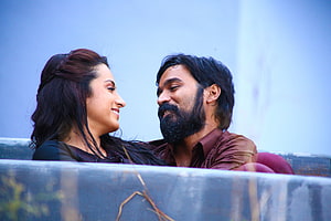 Dhanush and Trisha in a romantic scene from the Tamil film Kodi HD wallpaper