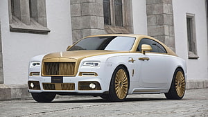White and Gold Rolls Royce Wraith Luxury Coupe Parked on Cobblestone Street HD wallpaper