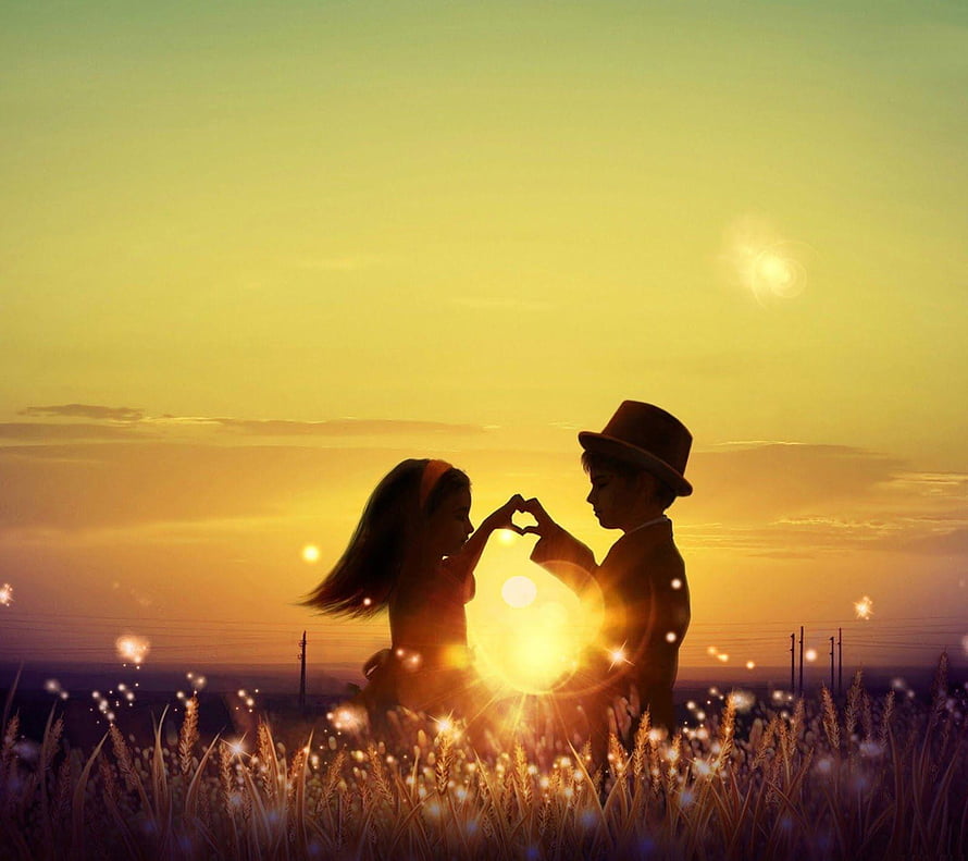 Romantic couple silhouette forming heart shape in golden wheat field at sunset HD wallpaper