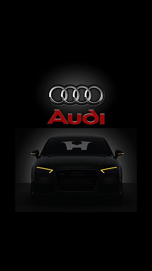 Audi Four Rings Logo and Black Sedan Front View with Amber LED Headlights on Dark Background HD phone wallpaper