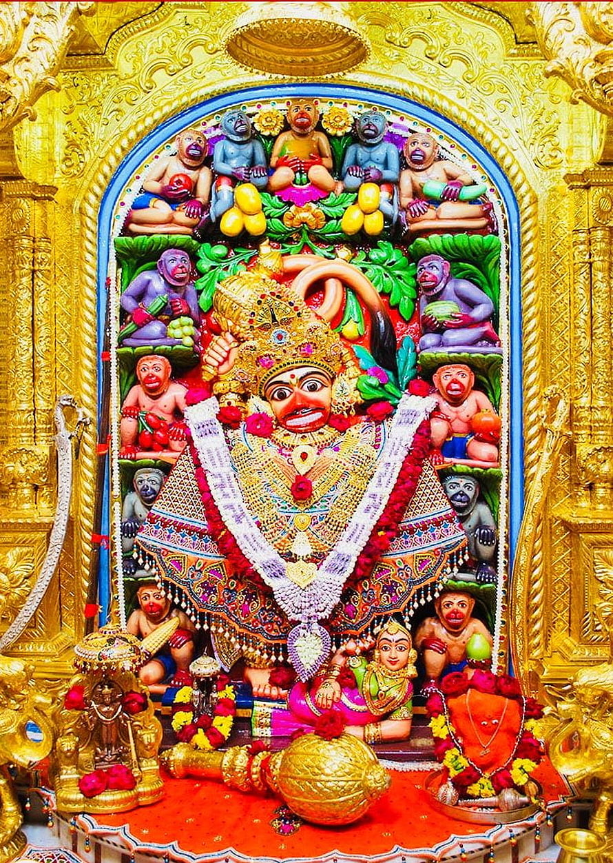 Salasar Balaji Temple Deity Surrounded by Colorful Monkey Figures and Golden Ornamentation HD phone wallpaper