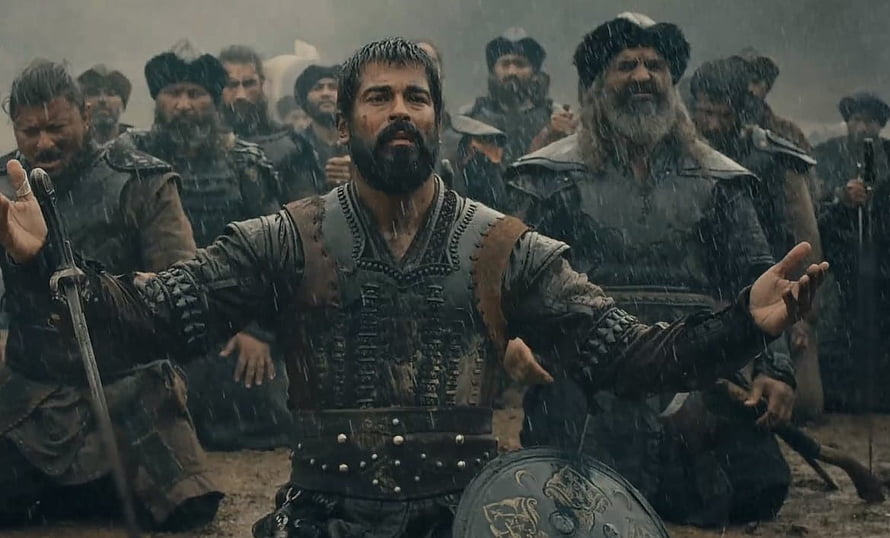 Kurulus Osman warrior in rain with sword and shield surrounded by soldiers HD wallpaper