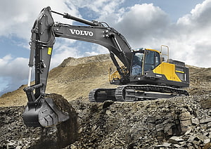 Volvo EC450E Excavator Digging in a Rocky Quarry Site HD wallpaper