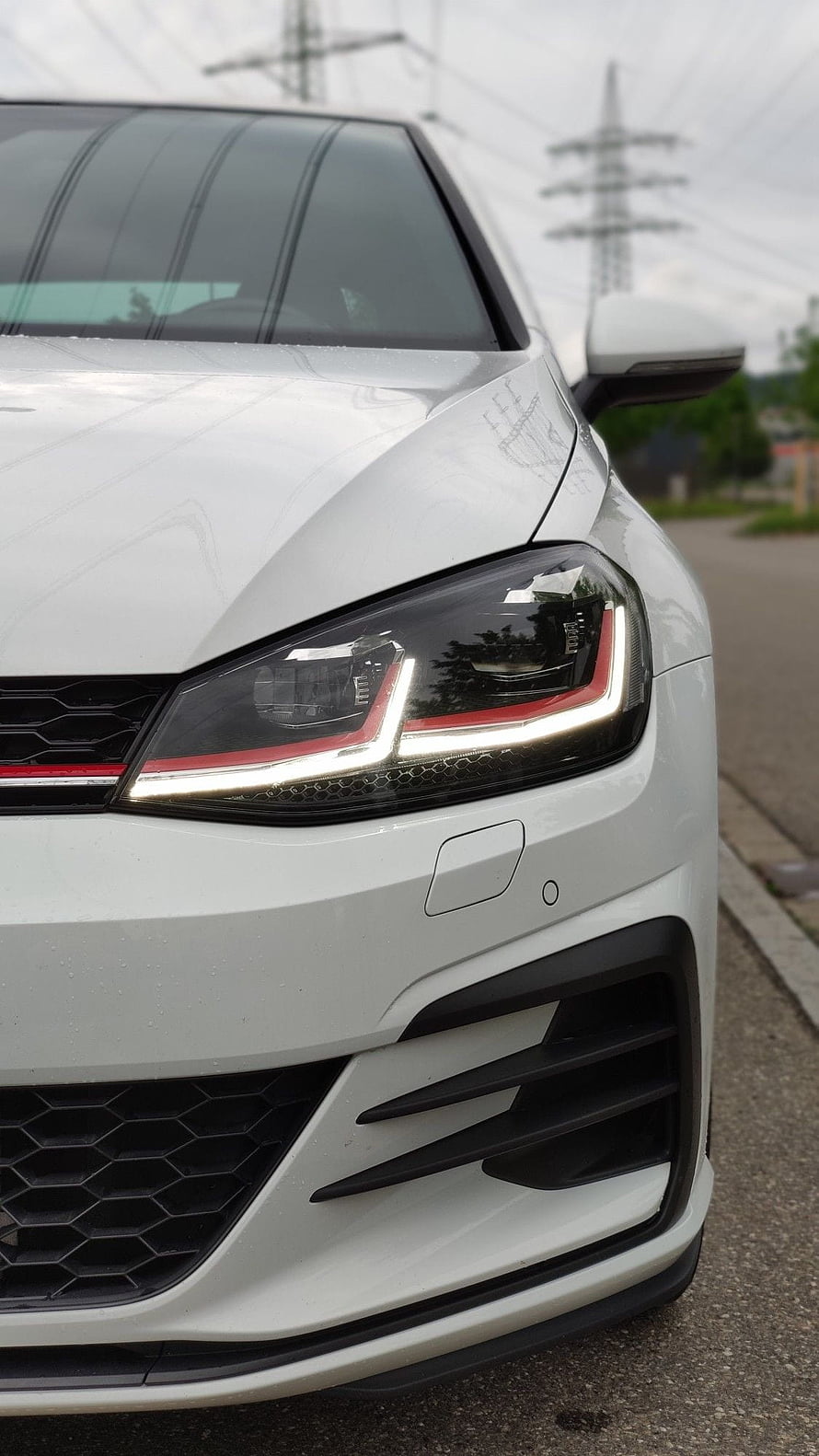 White Volkswagen Golf GTI Front Headlight and Grille Close-Up Detail HD phone wallpaper
