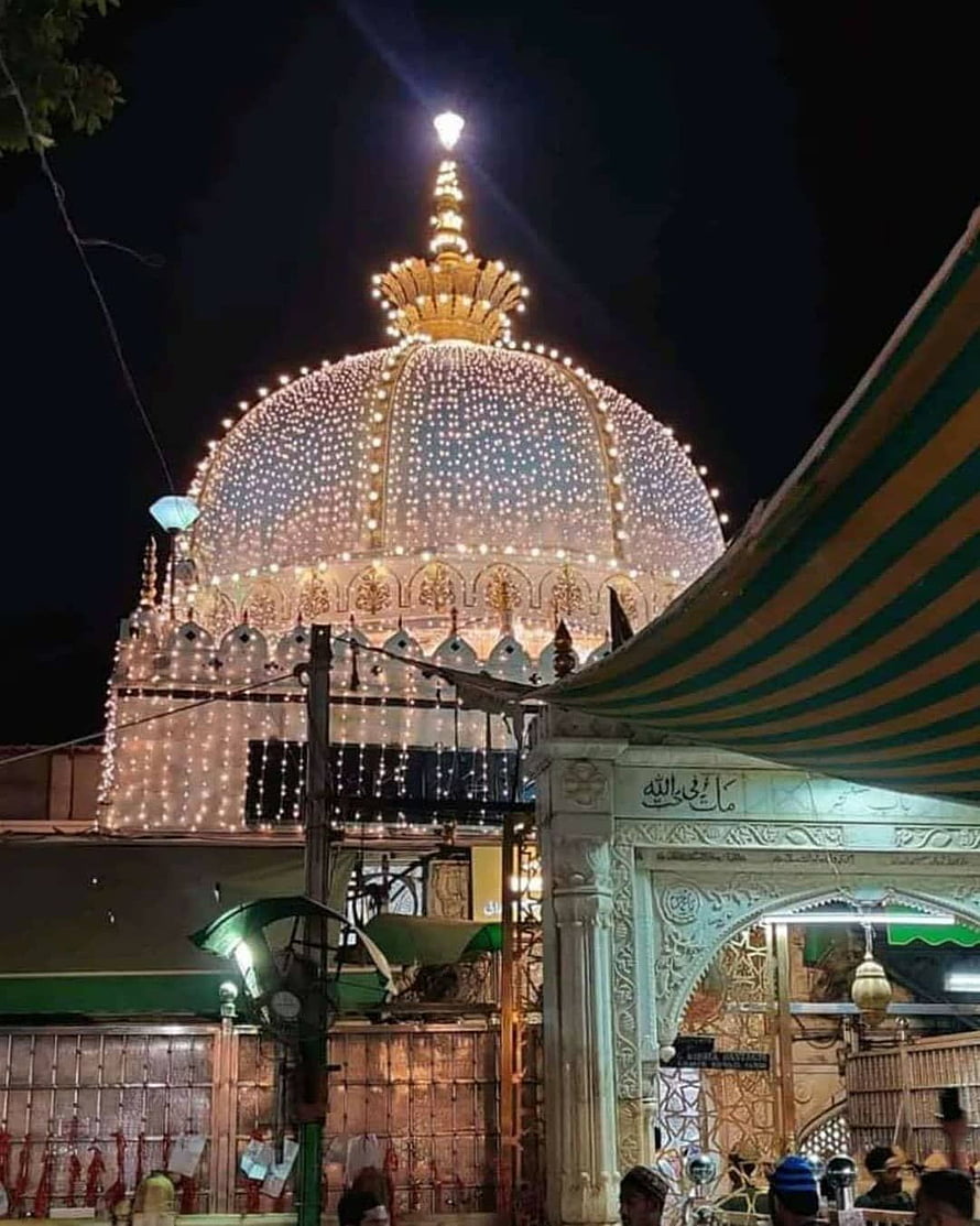 Illuminated Golden Dome of a Sufi Shrine at Night with Festive Lights HD phone wallpaper