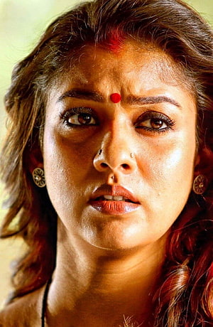 Nayanthara Close-Up Portrait with Traditional Bindis and Gold Earrings HD phone wallpaper