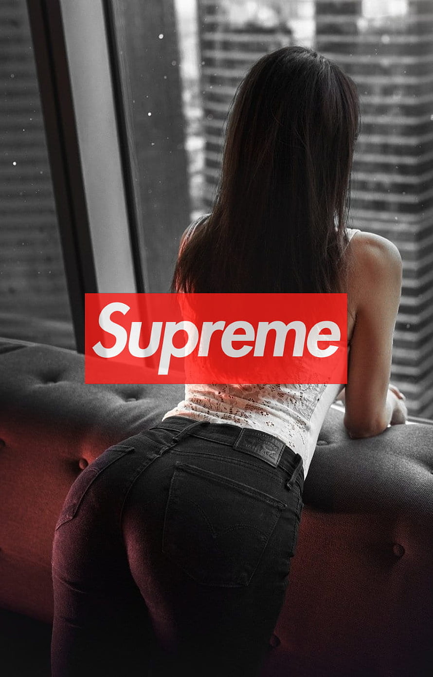 Supreme Logo Over Woman In Black Jeans Leaning On Tufted Sofa By Window HD phone wallpaper