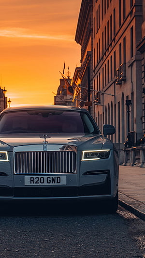Rolls Royce Ghost Front View Parked on City Street at Golden Hour Sunset HD phone wallpaper