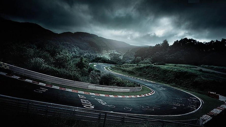 Nürburgring Nordschleife Curved Track Under Dramatic Stormy Sky HD wallpaper