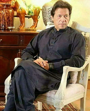 Imran Khan Seated in Formal Black Shalwar Kameez in an Elegant Interior HD phone wallpaper