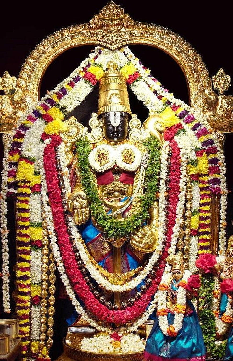 Ornate Venkateswara Swamy deity adorned with vibrant flower garlands and golden temple arch HD phone wallpaper