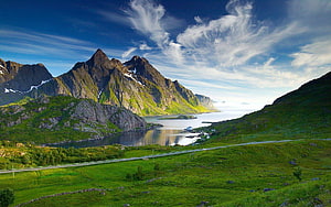 Norwegian Fjord Landscape with Dramatic Peaks and Lush Green Valleys HD wallpaper