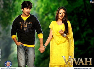 Vivah Movie Still Featuring Couple Walking Hand in Hand in Lush Green Garden HD wallpaper
