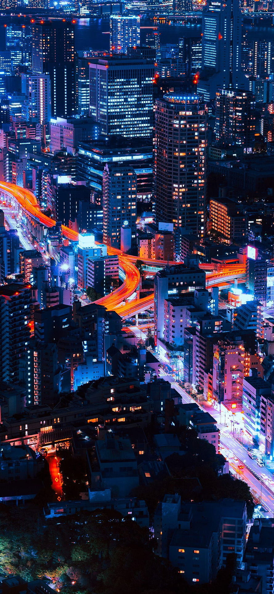 Aerial Night View of Tokyo Skyline with Glowing Highway Light Trails and City Lights HD phone wallpaper