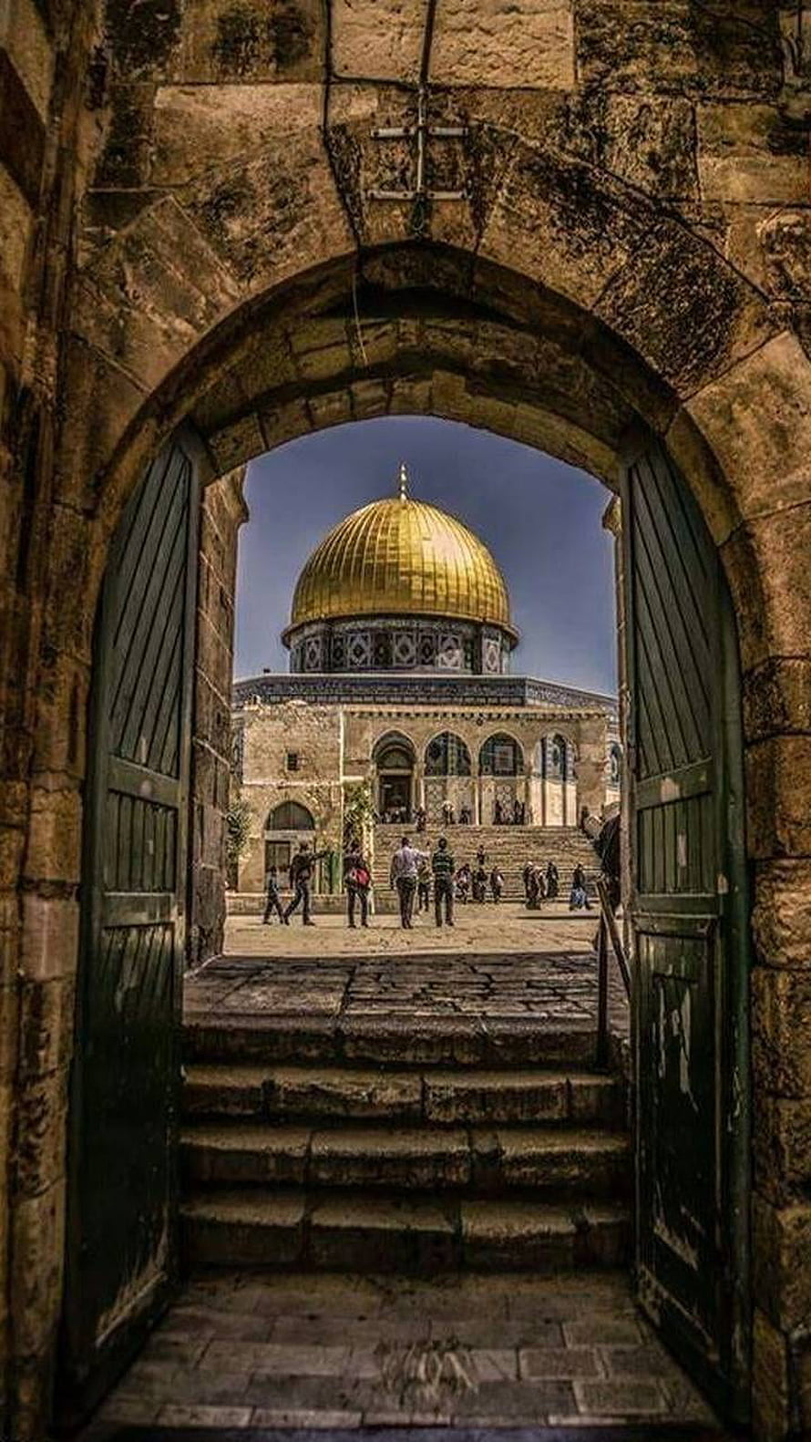 Dome of the Rock framed by ancient stone archway in Jerusalem HD phone wallpaper