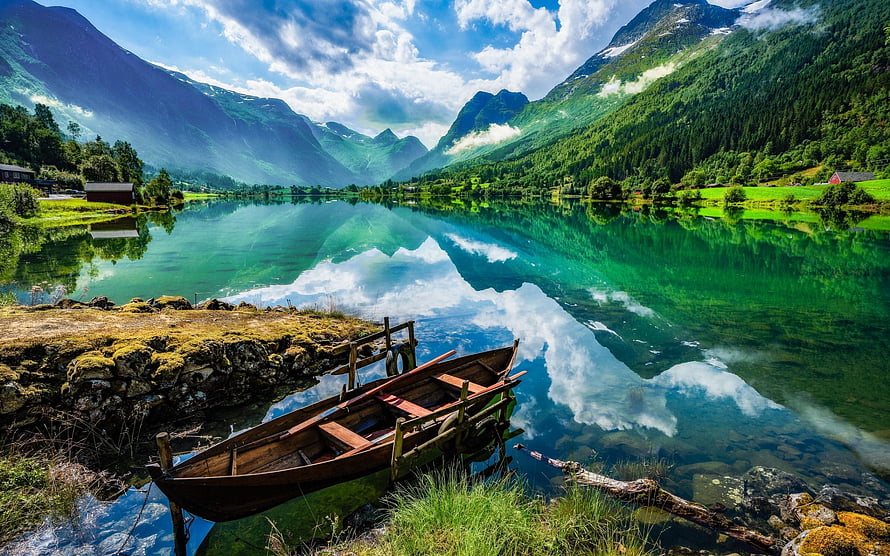 Norwegian Mountain Lake with Wooden Boat and Alpine Reflections HD wallpaper