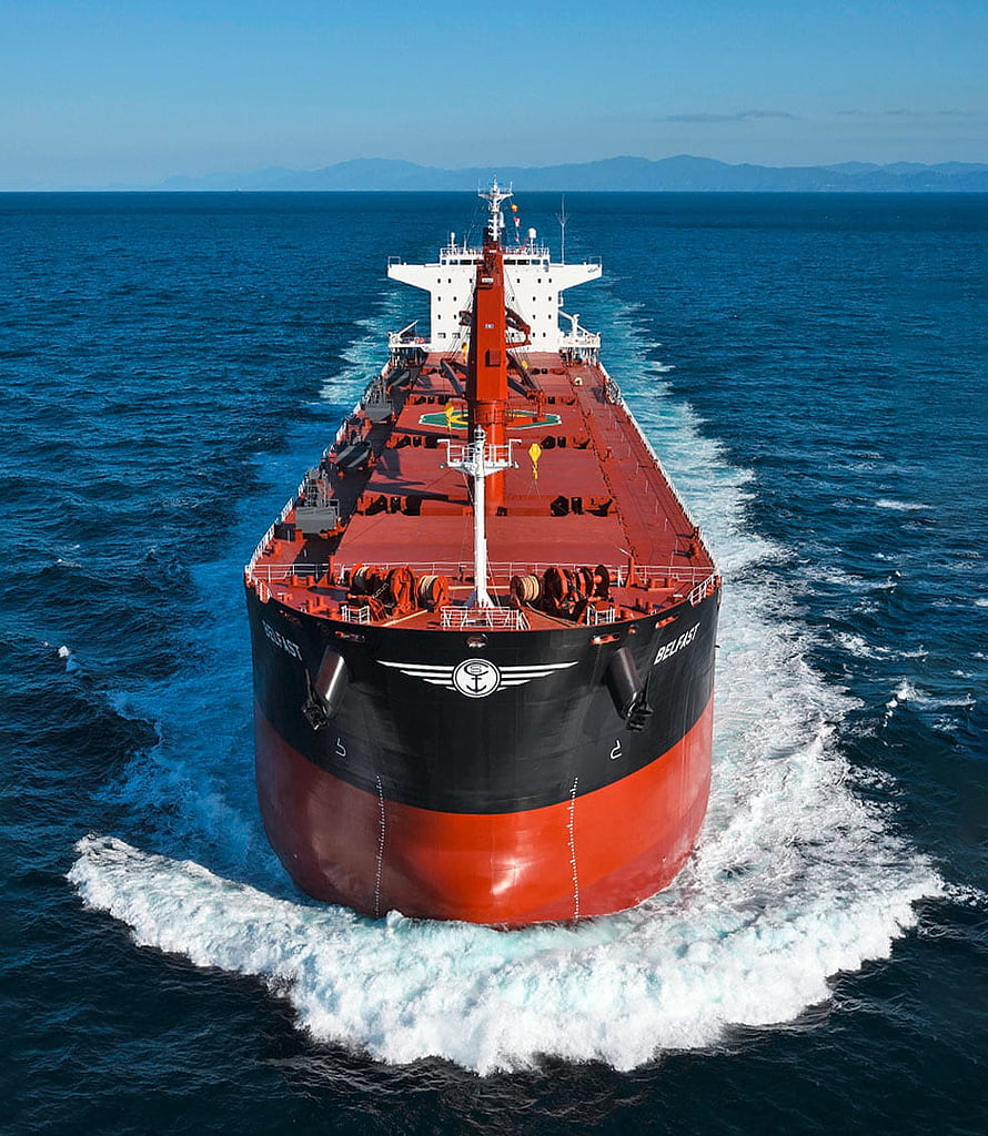 Frontal Aerial View of a Large Bulk Carrier Ship Cruising on the Open Ocean HD phone wallpaper